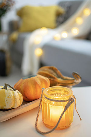 fall candle and gourds
